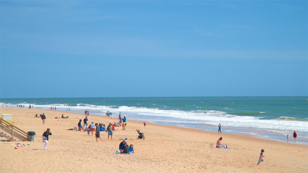 Bethany Beach which includes general coastal views and a beach as well as a small group of people