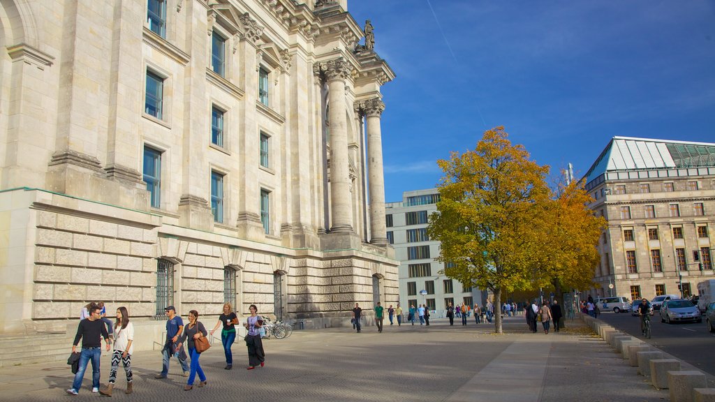 Reichstag Building showing a city, an administrative building and autumn leaves