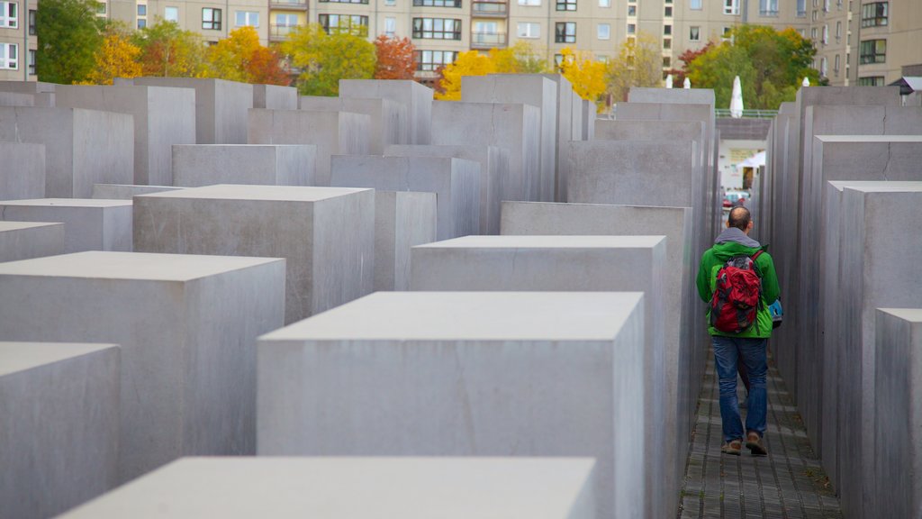 Holocaust Memorial featuring a memorial and a city as well as an individual male