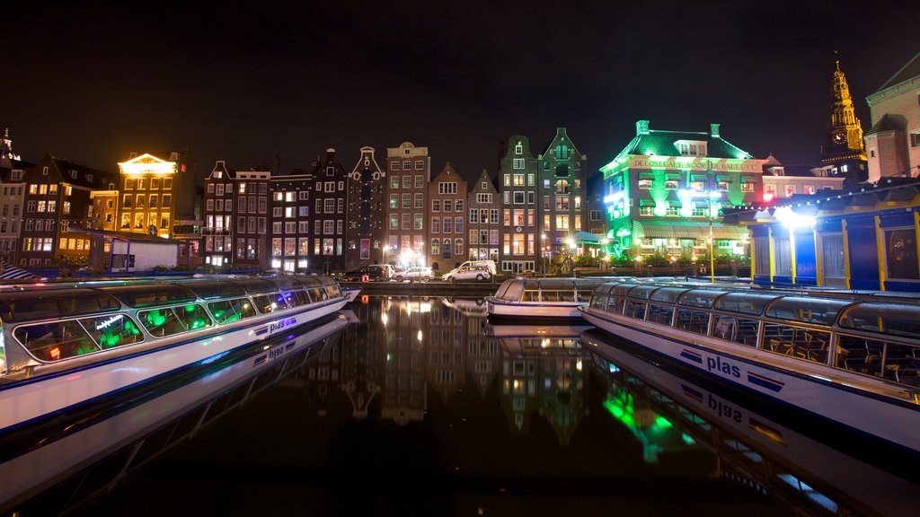 Amsterdam featuring night scenes, a marina and a ferry