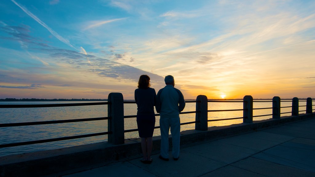 Charleston featuring general coastal views, hiking or walking and a sunset