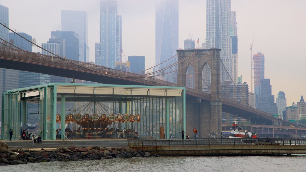 Jane’s Carousel featuring mist or fog, a high-rise building and a river or creek