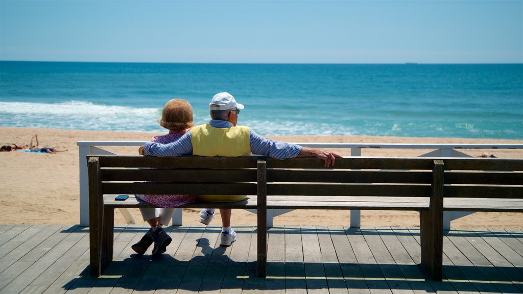 East Hampton Main Beach showing a sandy beach and general coastal views as well as a couple