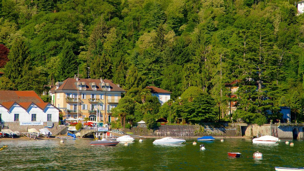 Stresa which includes a small town or village and a bay or harbour