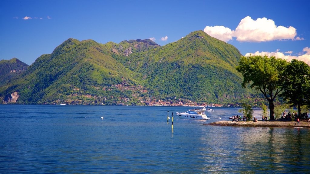 Isola dei Pescatori showing a lake or waterhole, mountains and a garden