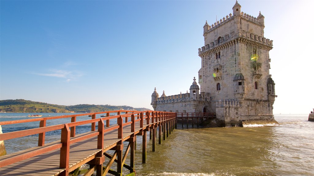 Belem Tower which includes heritage architecture, general coastal views and a bridge