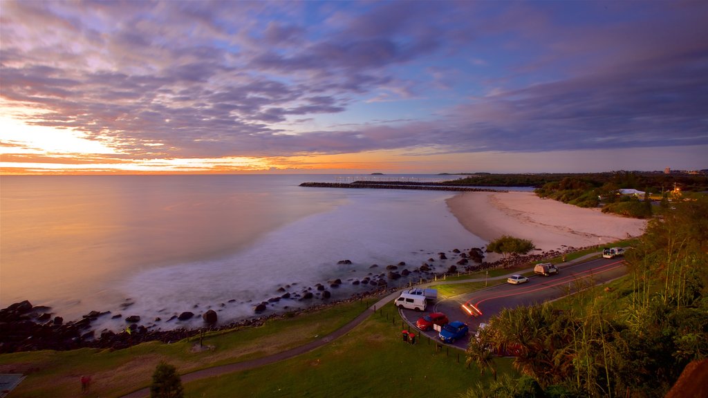 Point Danger which includes a sandy beach, general coastal views and a sunset