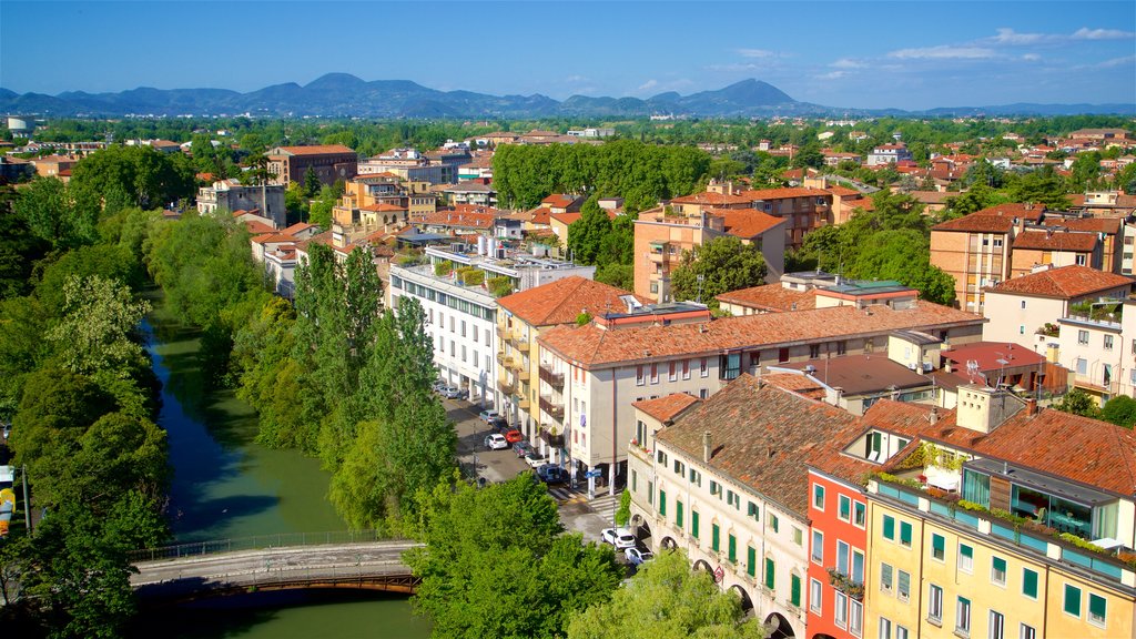 La Specola Observatory which includes landscape views, a river or creek and a city