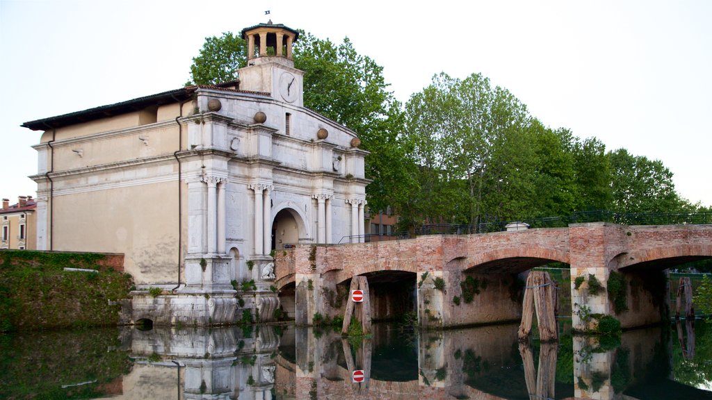 Porta Ognissanti which includes a bridge, a river or creek and heritage elements