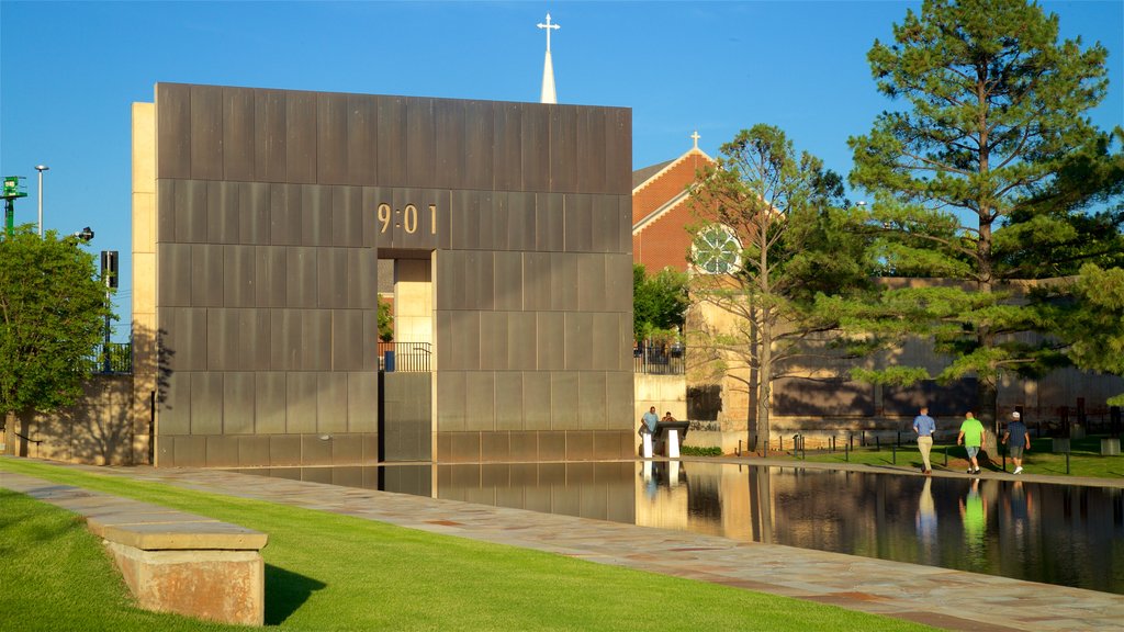 Oklahoma City National Memorial and Museum showing modern architecture, a park and a pond