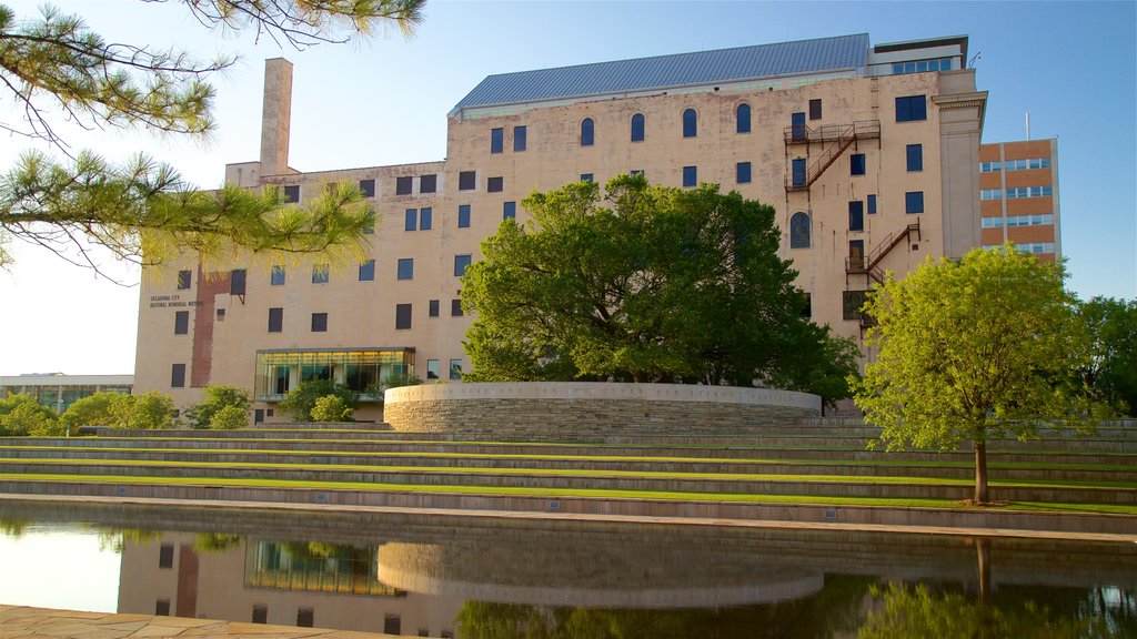 Oklahoma City National Memorial and Museum featuring a garden, a sunset and a pond