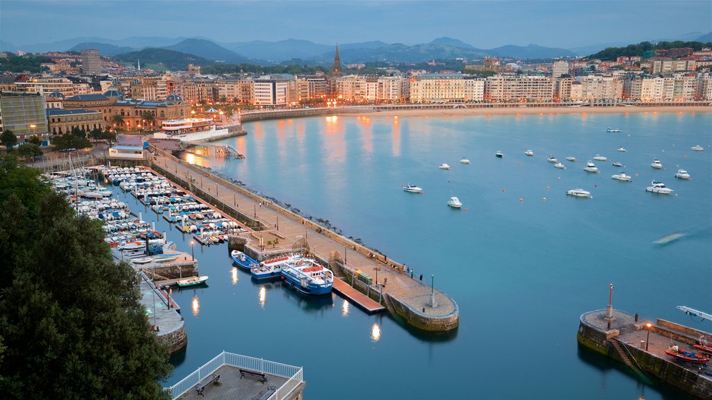 Monte Urgull which includes a bay or harbour, a coastal town and landscape views