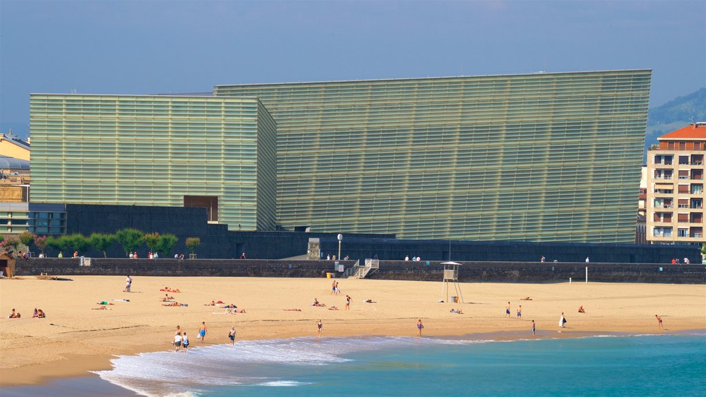 Zurriola Beach which includes modern architecture, general coastal views and a beach