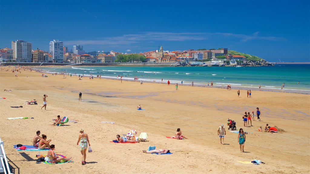 San Lorenzo Beach showing a coastal town, a city and a beach