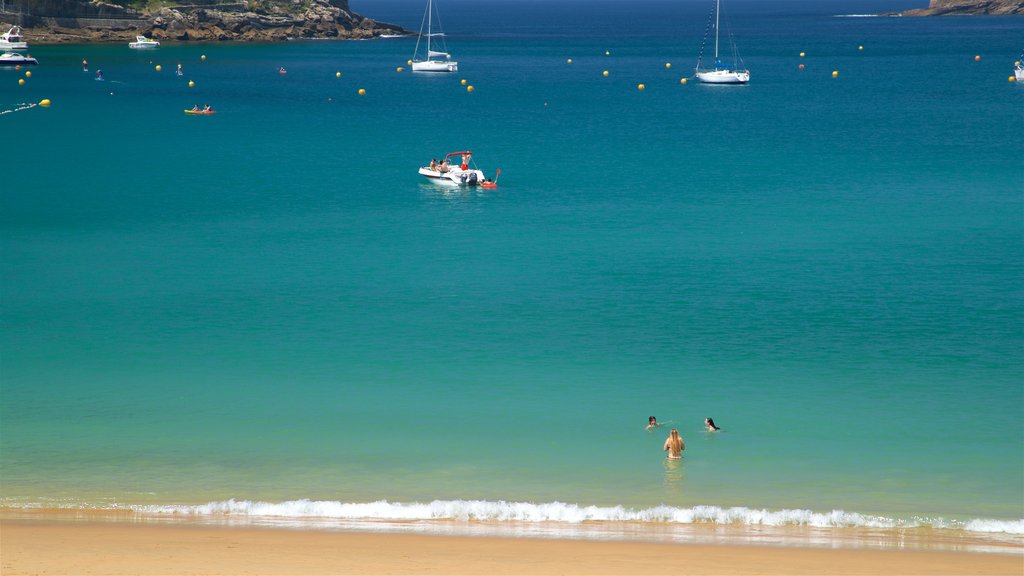 Ondarreta Beach showing a bay or harbour, general coastal views and swimming