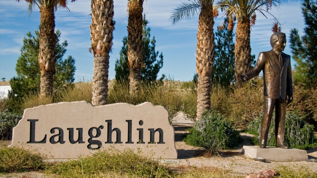 Laughlin showing signage, a statue or sculpture and a monument