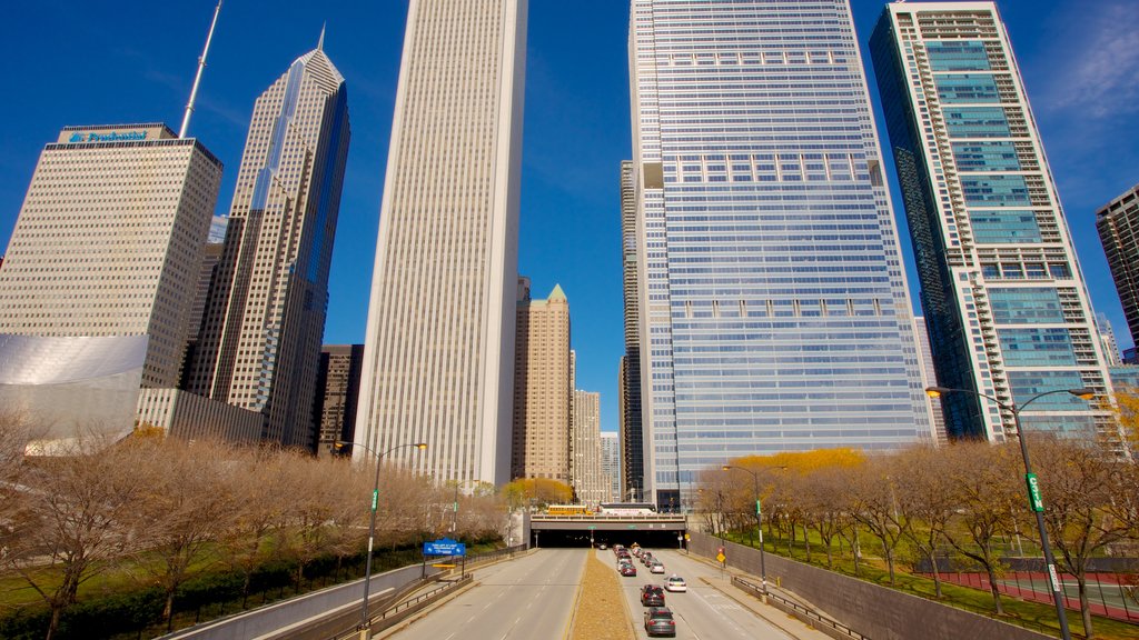 Millennium Park which includes a skyscraper, modern architecture and a city