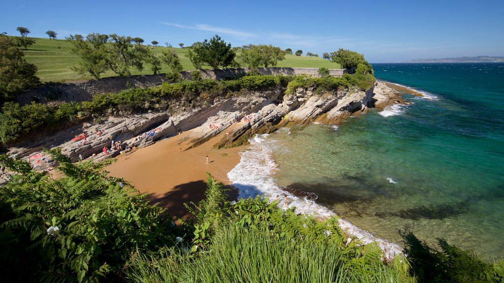 El Sardinero Beach which includes rugged coastline, a sandy beach and general coastal views