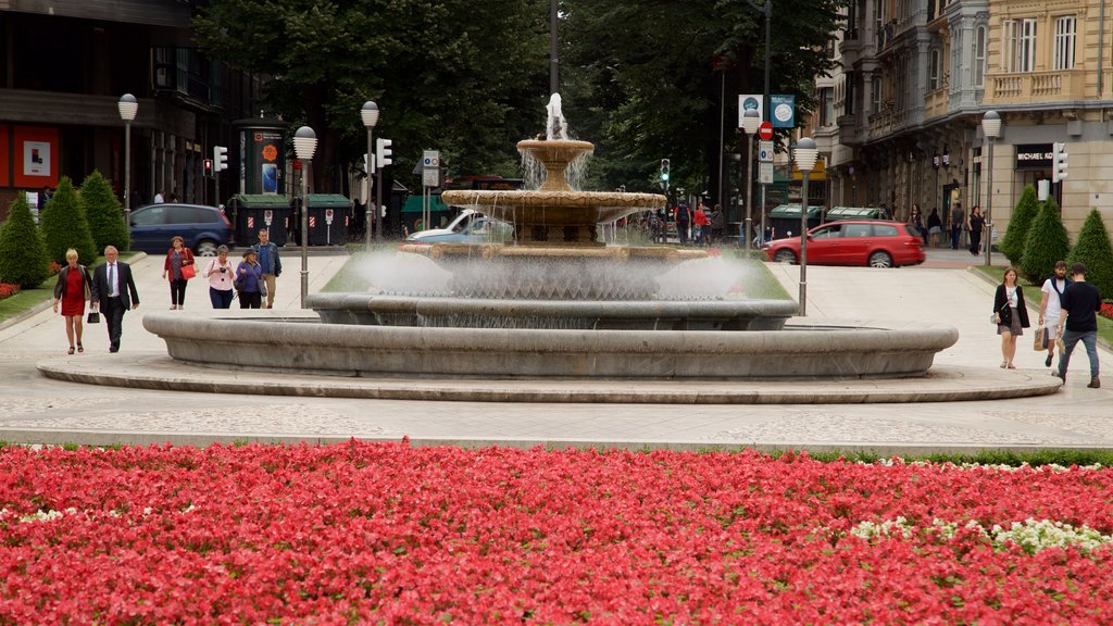 Plaza Moyúa ofreciendo una fuente, flores y jardín