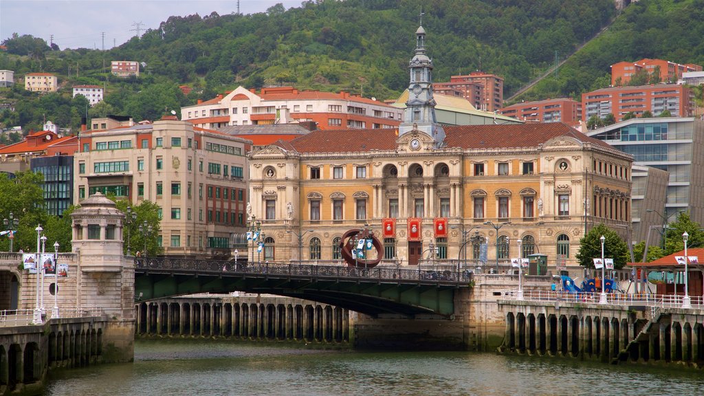 Bilbao City Hall which includes a river or creek, heritage architecture and a bridge