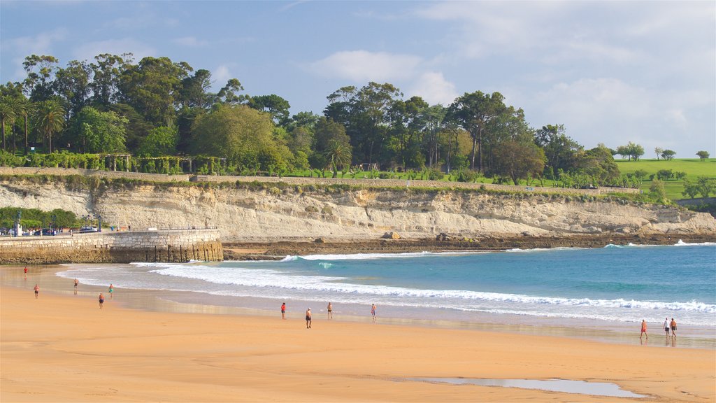 Camello Beach showing rocky coastline, general coastal views and a beach