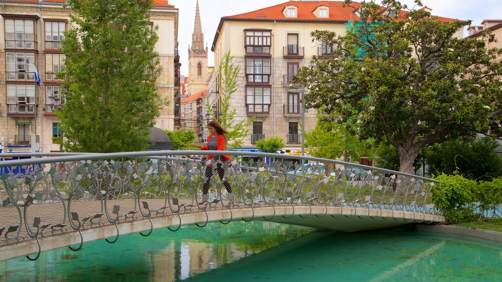 Jardines de Pereda showing hiking or walking, a river or creek and a bridge