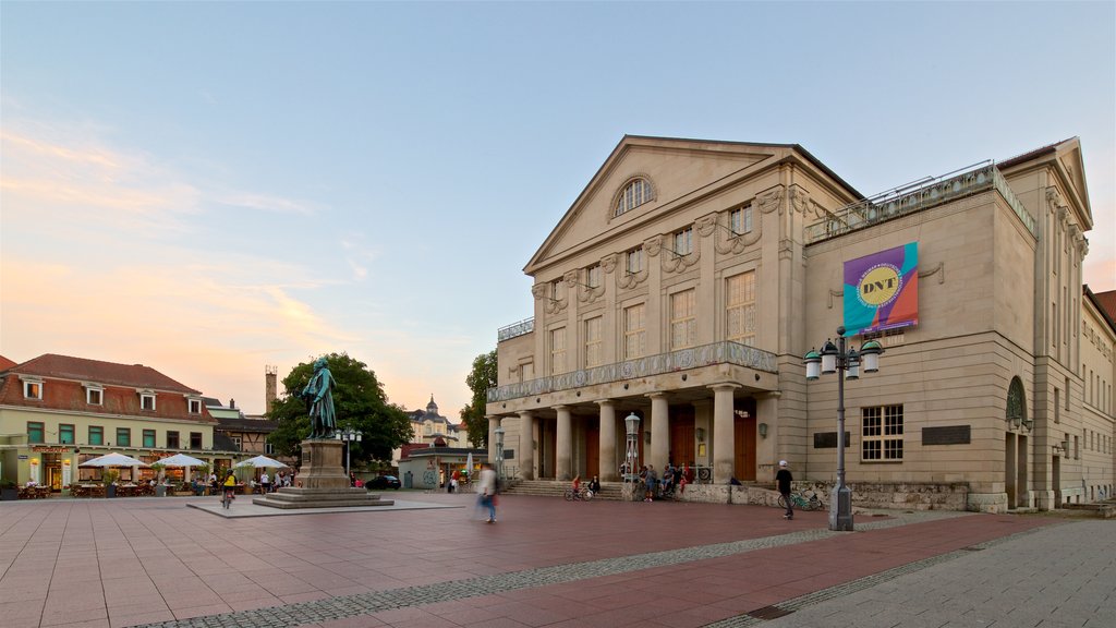 Goethe-Schiller Monument showing a square or plaza, a sunset and heritage architecture