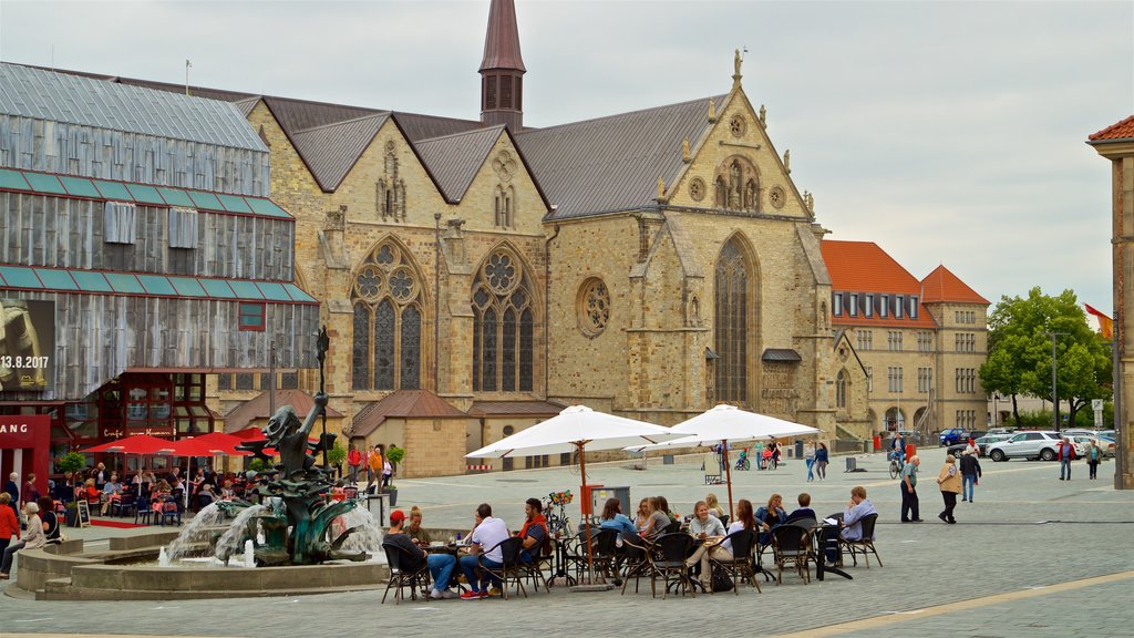 Catedral de Paderborn mostrando una iglesia o catedral, comer al aire libre y una fuente