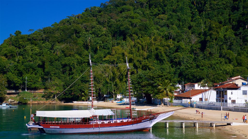 Bonfim Beach featuring a sandy beach, a coastal town and a bay or harbour