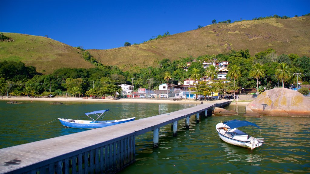 Enseada Beach which includes a bay or harbour, a coastal town and general coastal views