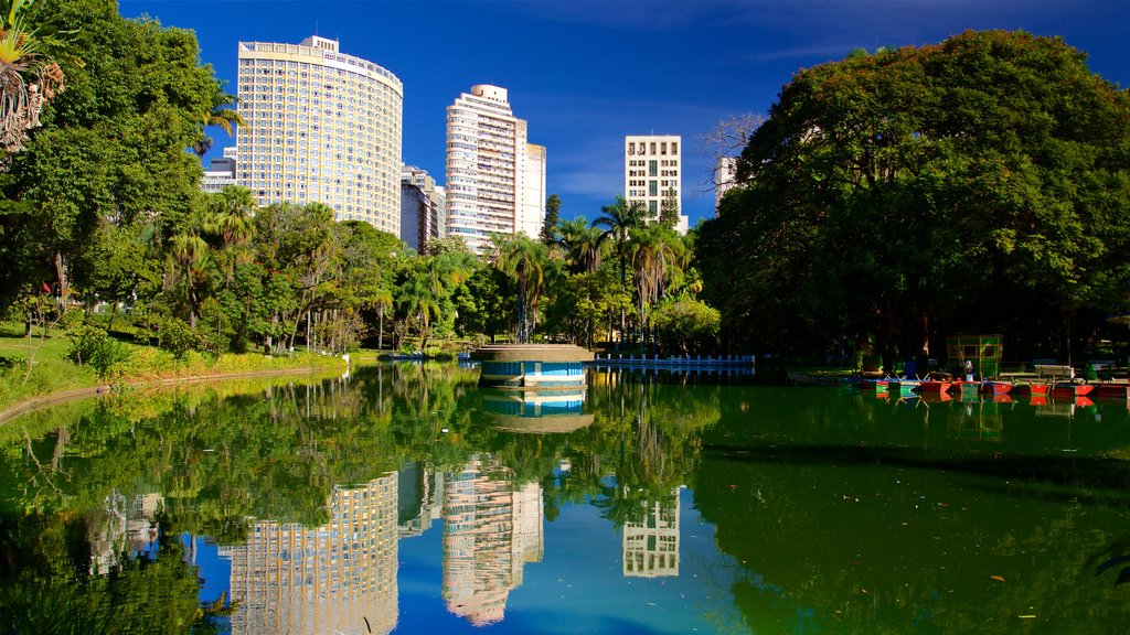 Americo Renne Giannetti Municipal Park showing a pond, a garden and a city