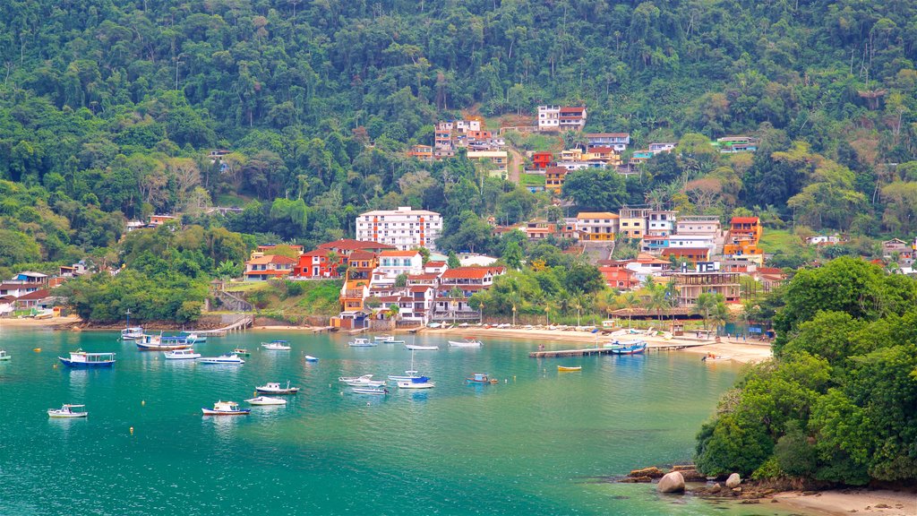 Camorim Beach showing a bay or harbour, general coastal views and a coastal town