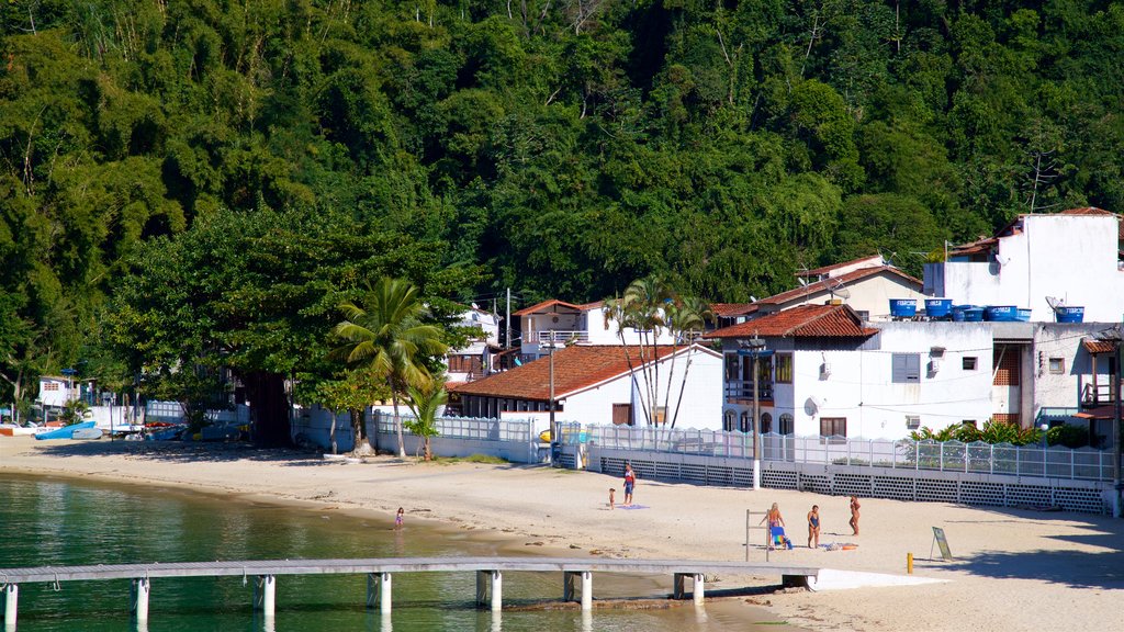 Bonfim Beach showing a coastal town, tropical scenes and a beach