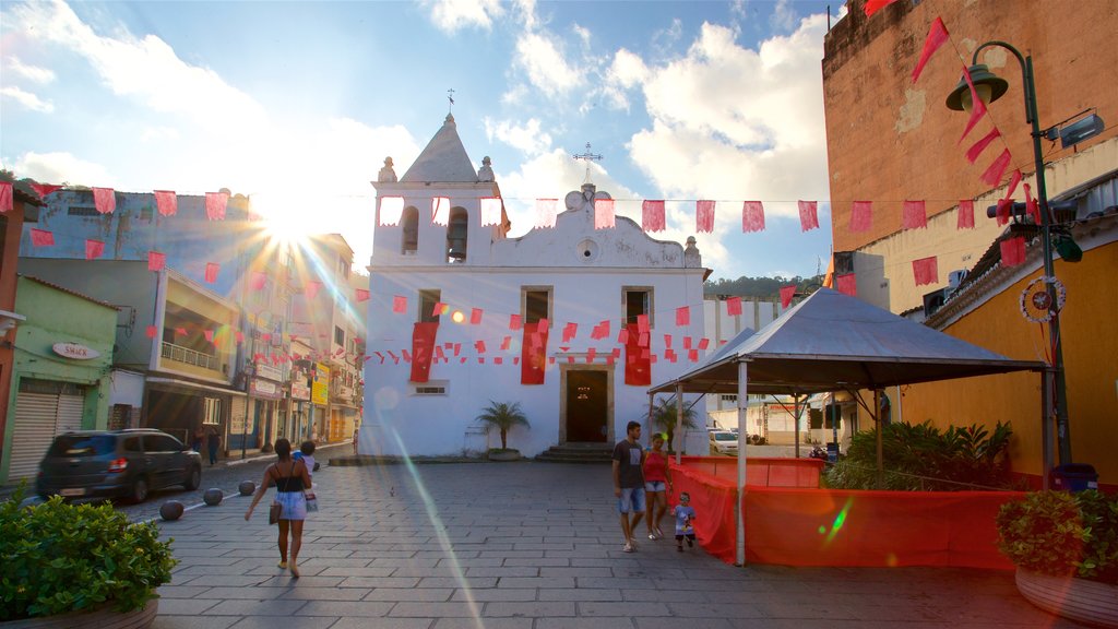 Nossa Senhora da Conceicao Church showing a church or cathedral and street scenes as well as a small group of people