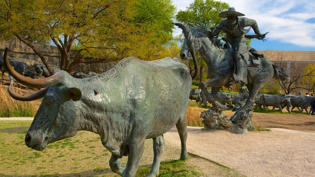 Pioneer Plaza showing a statue or sculpture and outdoor art