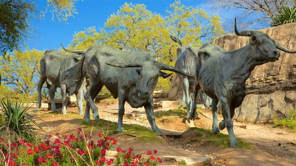 Pioneer Plaza featuring wildflowers, a statue or sculpture and outdoor art