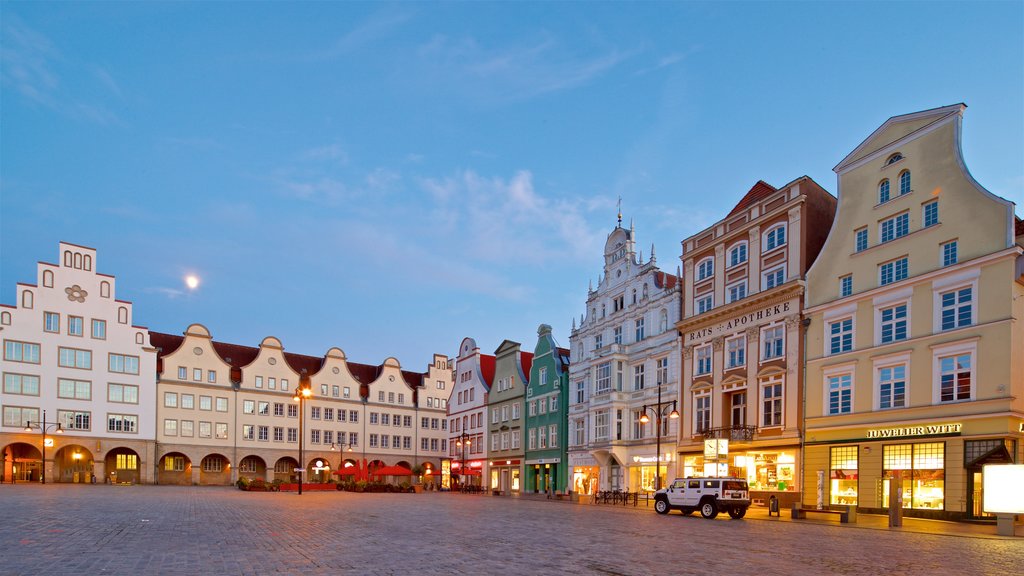 New Market showing a square or plaza, night scenes and heritage elements