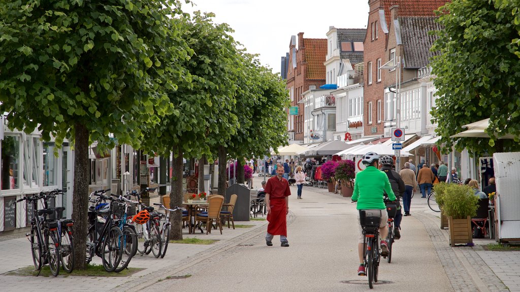 Travemuende featuring street scenes and cycling as well as a small group of people