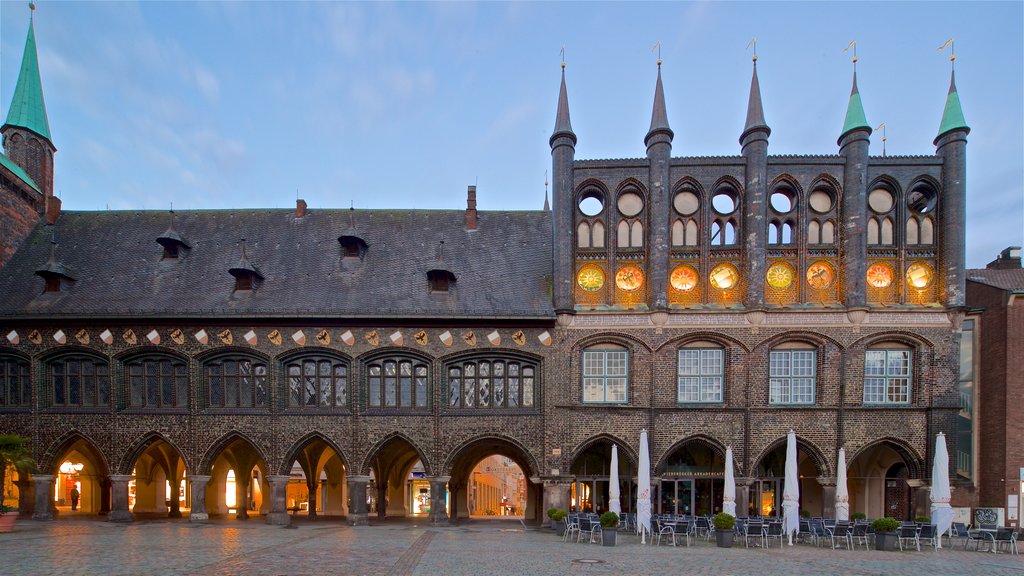 Rathaus which includes night scenes and heritage architecture