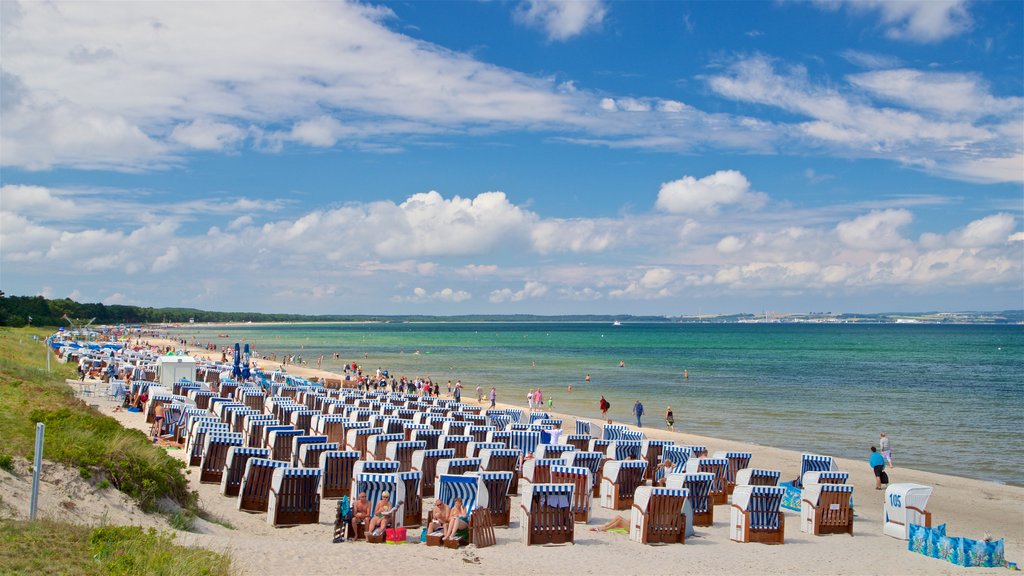 Binz Beach showing a beach and general coastal views as well as a small group of people