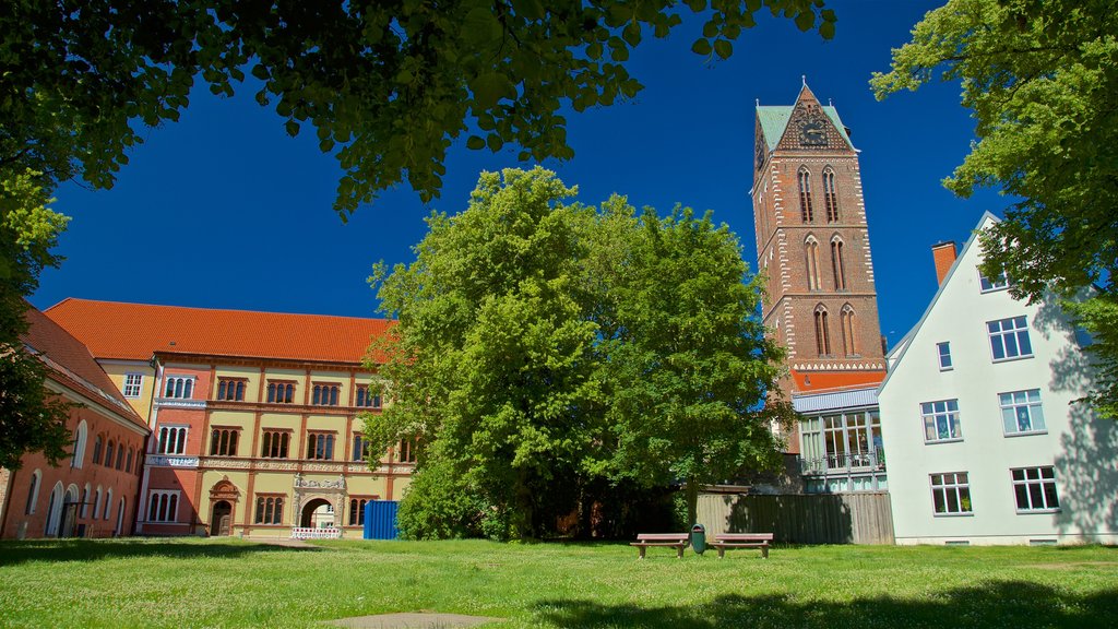 St-Marien-Kirche Steeple showing heritage architecture and a garden