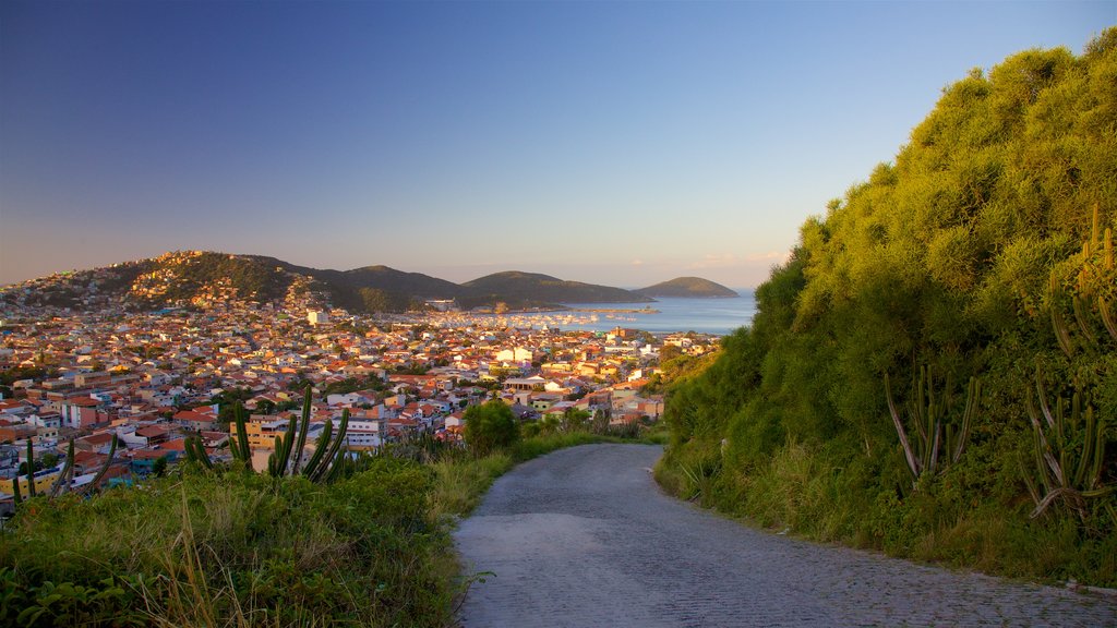 Atalaia Viewpoint which includes a sunset, a coastal town and general coastal views