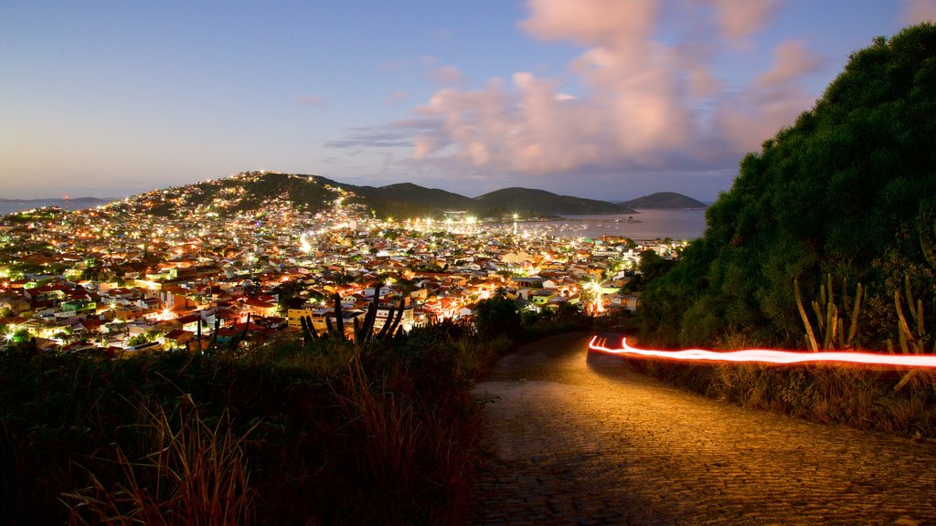 Atalaia Viewpoint which includes night scenes, general coastal views and a coastal town