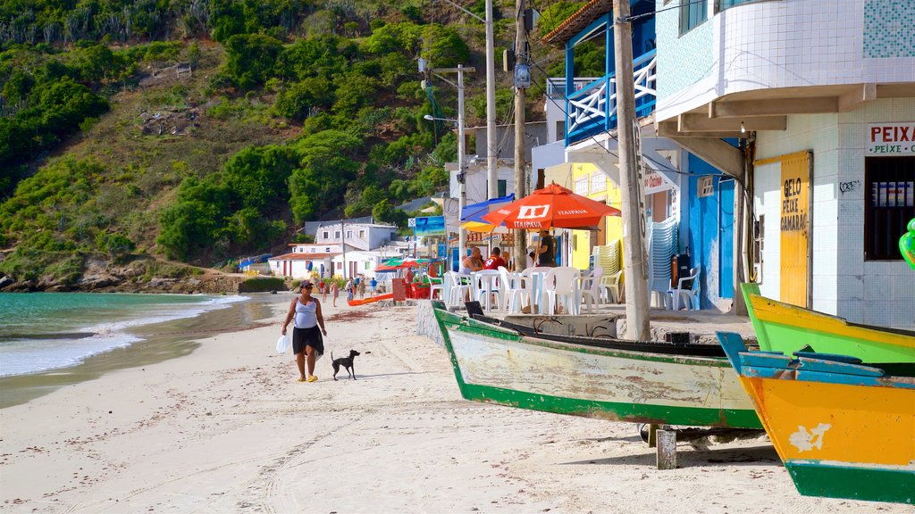 Prainha Beach showing a beach, a coastal town and general coastal views