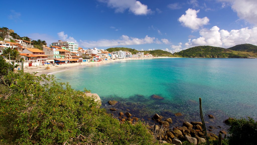 Prainha Beach which includes a coastal town and general coastal views