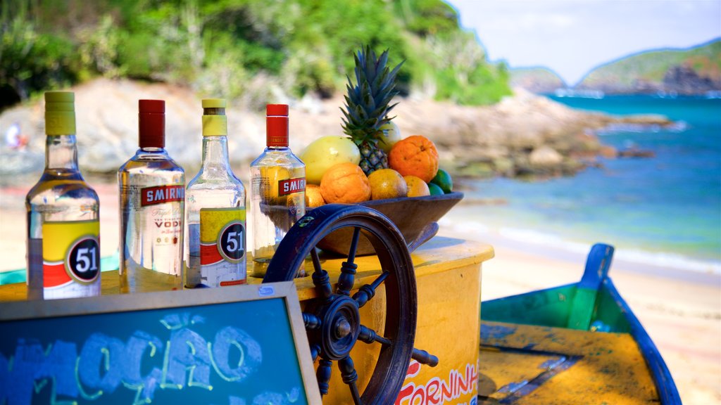 Forno Beach which includes drinks or beverages, general coastal views and a beach bar