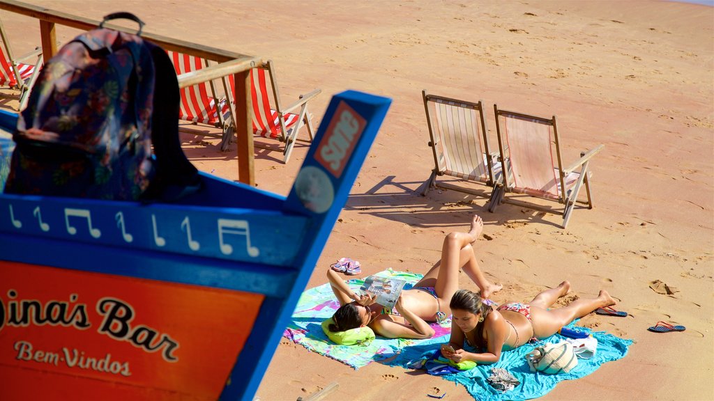 Joao Fernandes Beach showing general coastal views and a sandy beach as well as a couple