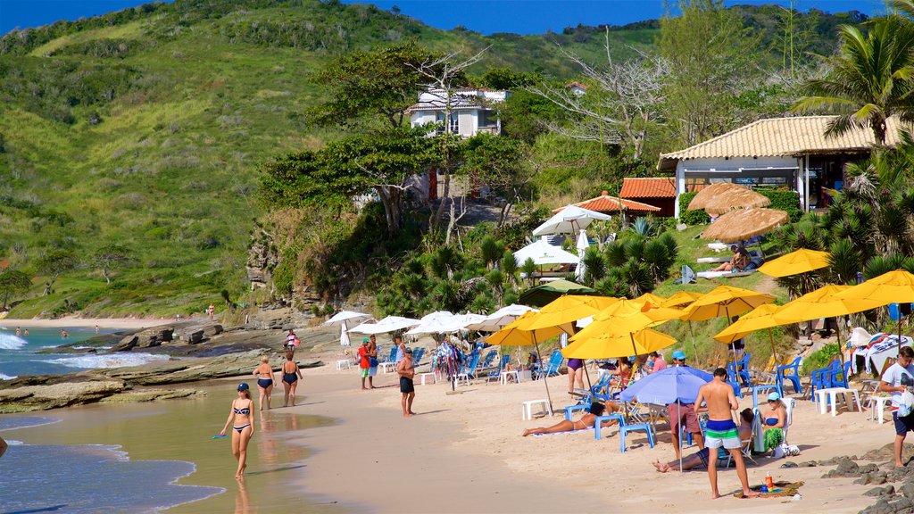 Brava Beach which includes a beach and general coastal views as well as a small group of people