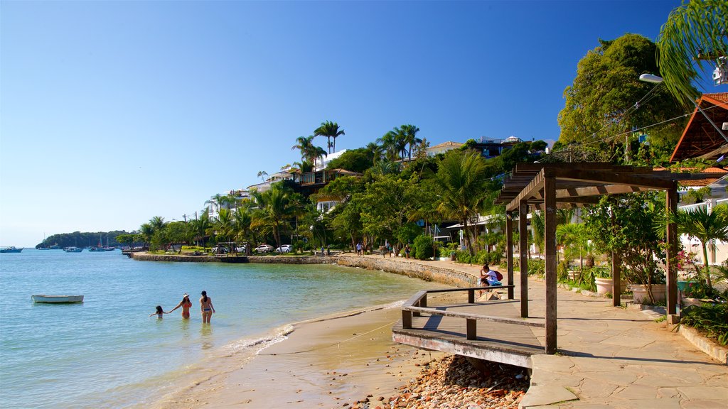 Armacao Beach which includes swimming, general coastal views and a sandy beach