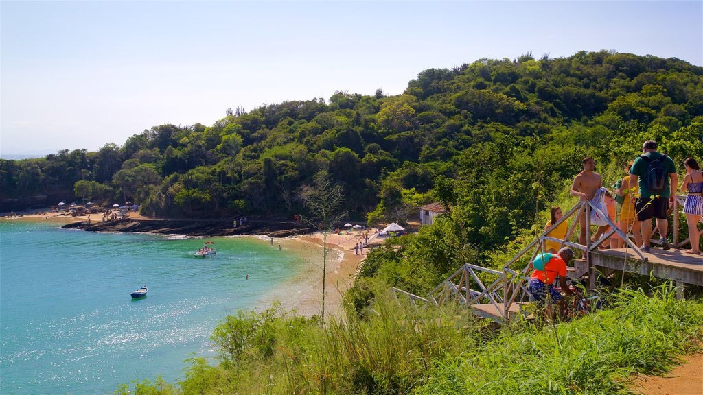 Azeda Beach showing general coastal views as well as a small group of people